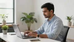 Professional working on data entry jobs from home on laptop with organized workspace